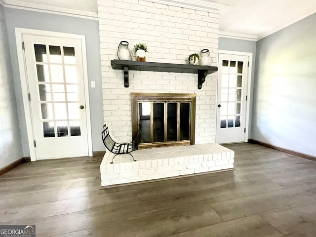 interior space featuring hardwood / wood-style floors, a fireplace, and ornamental molding