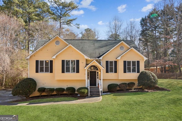 raised ranch with a front yard