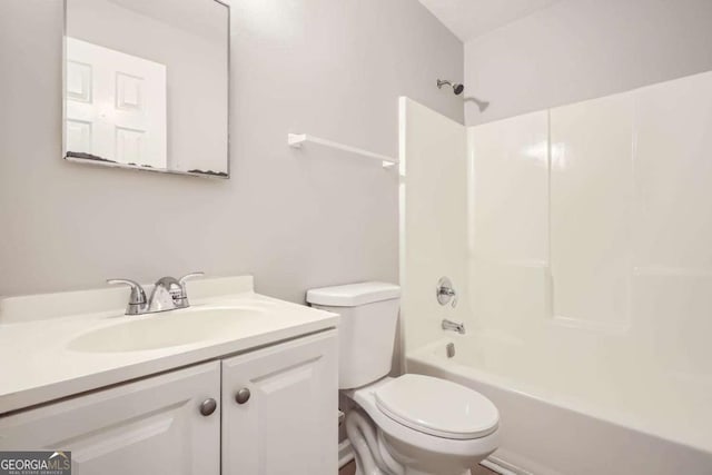 full bath with shower / bathing tub combination, toilet, and vanity