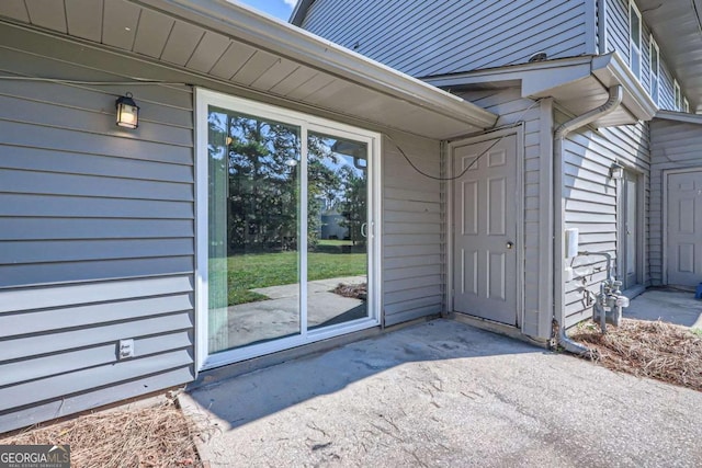 doorway to property with a patio