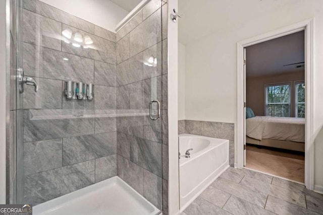 bathroom with separate shower and tub