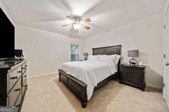 bedroom with ceiling fan and light colored carpet