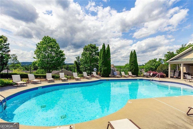 view of pool featuring a patio area