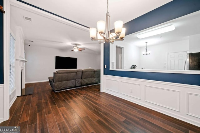 interior space with ceiling fan with notable chandelier and dark wood-type flooring