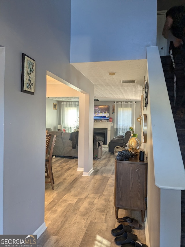 hallway with hardwood / wood-style floors