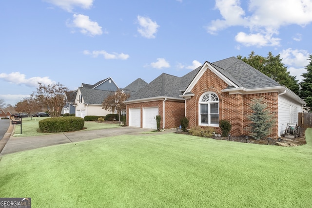 view of front of home with a garage and a front lawn