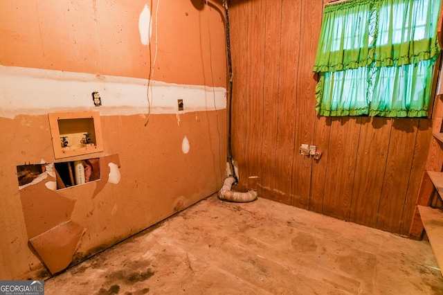 washroom with washer hookup and wooden walls