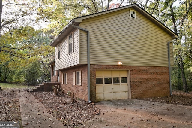 view of side of property with a garage