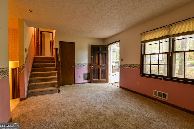 interior space featuring a textured ceiling