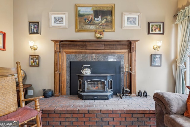 interior details with a wood stove and baseboards