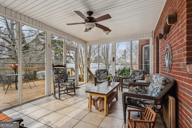 sunroom featuring a ceiling fan