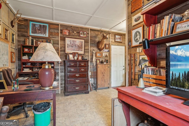 home office featuring wood walls