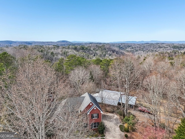 bird's eye view featuring a mountain view and a view of trees