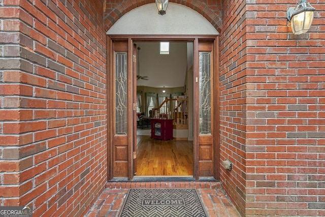 property entrance featuring brick siding