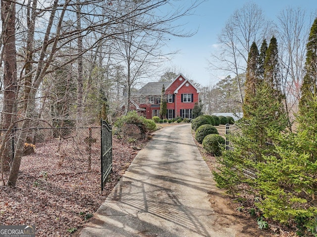 view of road featuring a gate, driveway, and a gated entry