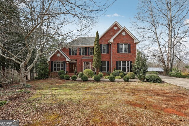 view of property exterior featuring a garage and central air condition unit