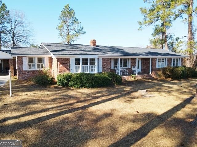 ranch-style house with a front lawn