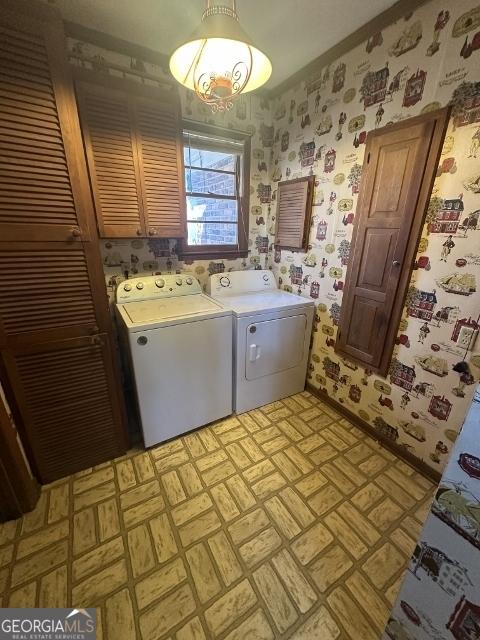 laundry area with cabinets and washer and dryer