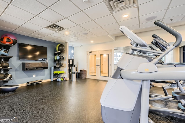 gym featuring a drop ceiling