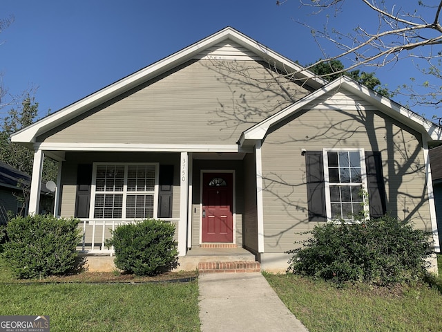 view of front of property featuring covered porch
