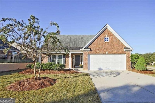 view of front facade featuring a garage and a front yard