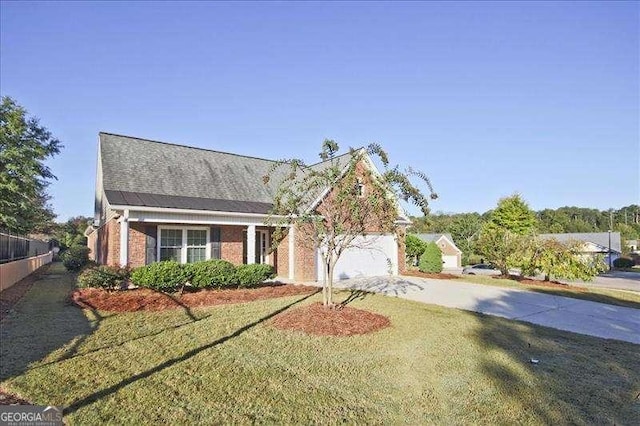 view of front of property with a garage and a front lawn