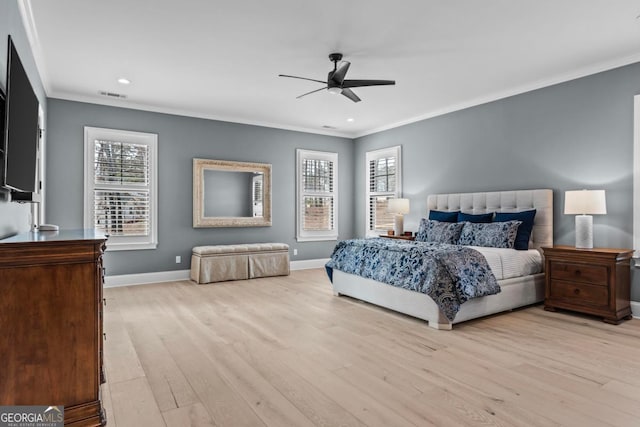 bedroom with ornamental molding, ceiling fan, and light wood-type flooring