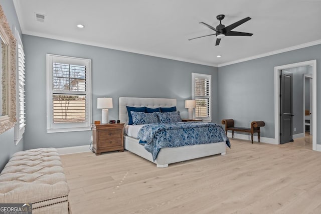 bedroom with ceiling fan, ornamental molding, and light wood-type flooring