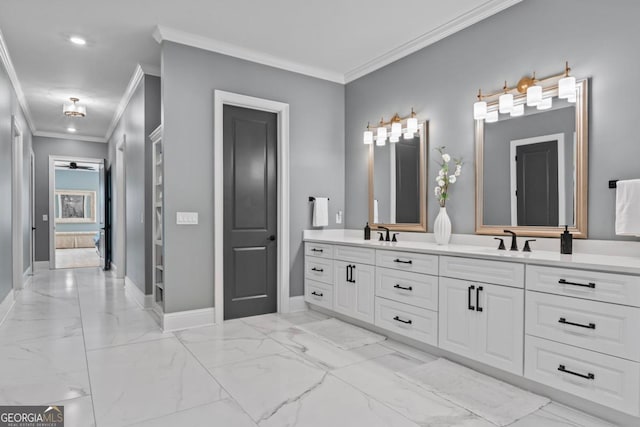 bathroom with crown molding and vanity