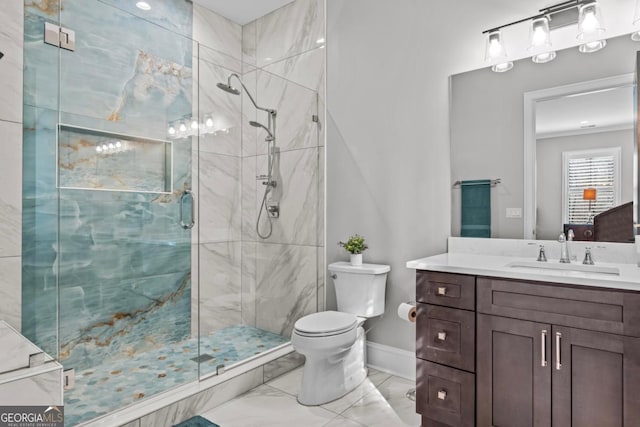 bathroom with vanity, toilet, and an enclosed shower