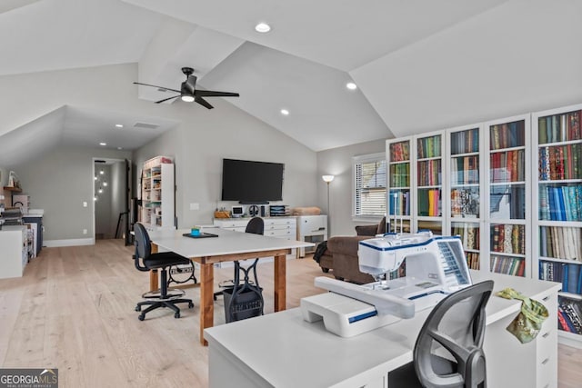 office with light hardwood / wood-style flooring, ceiling fan, and vaulted ceiling