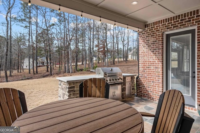 view of patio / terrace featuring grilling area and an outdoor kitchen