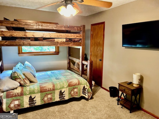 bedroom featuring ceiling fan and carpet flooring