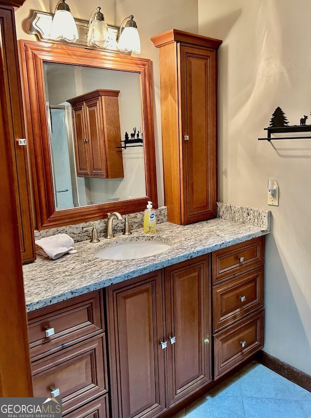 bathroom featuring tile patterned floors and vanity