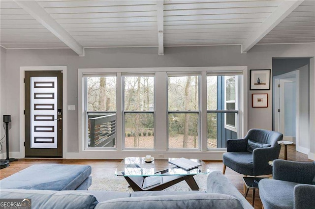 living room featuring hardwood / wood-style flooring, beam ceiling, and wooden ceiling