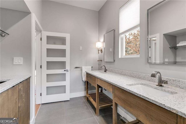 bathroom with tile patterned flooring and vanity