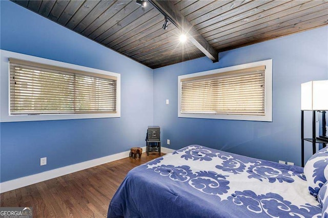 bedroom featuring vaulted ceiling with beams, dark hardwood / wood-style floors, multiple windows, and wooden ceiling