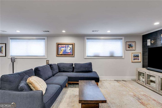 living room with ornamental molding