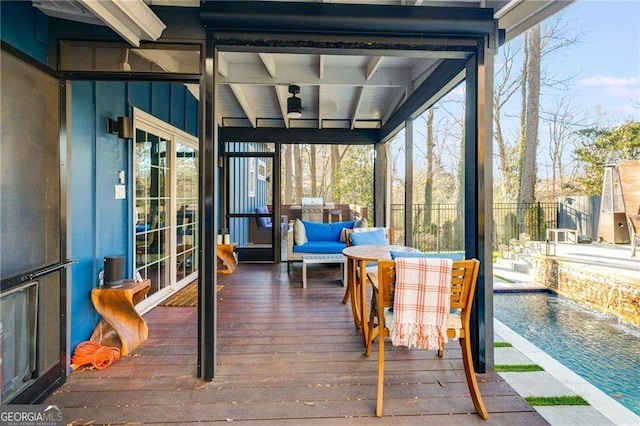 sunroom / solarium with beamed ceiling