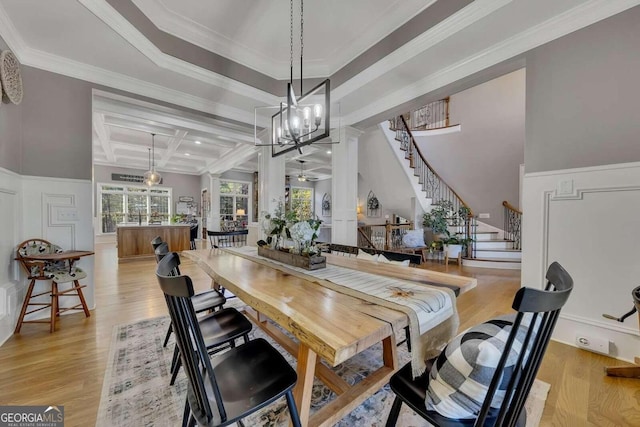 dining room featuring beam ceiling, crown molding, coffered ceiling, and light hardwood / wood-style floors