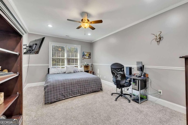 bedroom with ceiling fan, ornamental molding, and carpet flooring