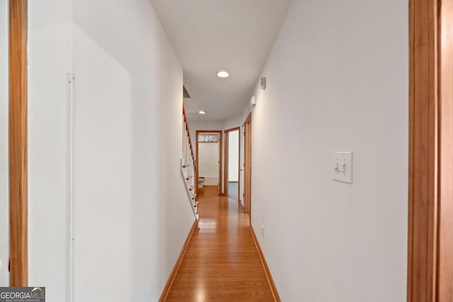 hall with light wood-type flooring