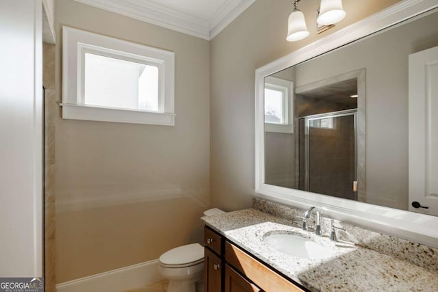 bathroom featuring crown molding, toilet, vanity, and walk in shower