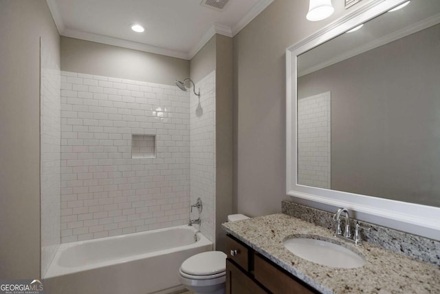 full bathroom with vanity, tiled shower / bath combo, ornamental molding, and toilet