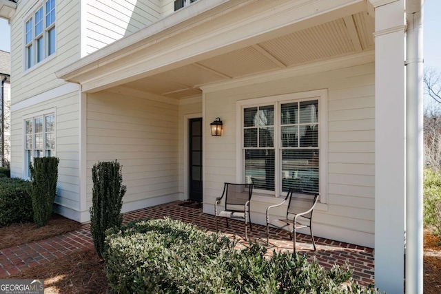 view of exterior entry featuring a porch