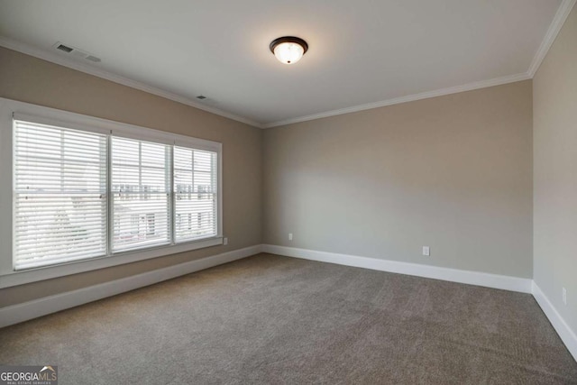 carpeted spare room with crown molding