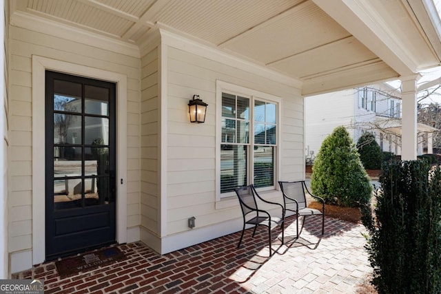 property entrance with covered porch