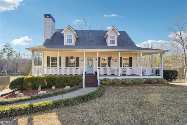 farmhouse with a porch and a front yard