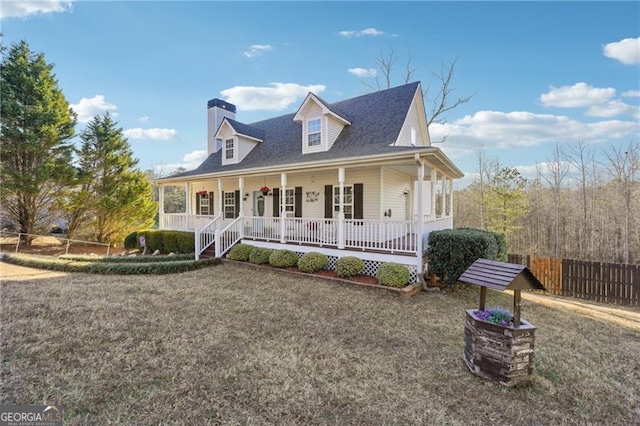 view of front of home featuring covered porch and a front lawn