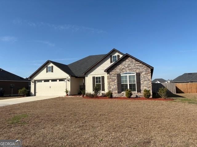 view of front facade featuring a garage and a front lawn